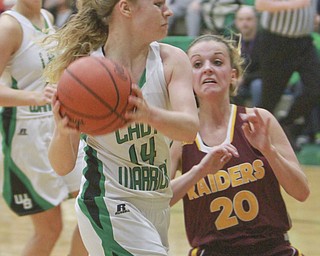 William D Lewis the Vindicator West Branch's Melinda Trimmer(14)passes around Kaylee Manning (20) ofSouth Range.