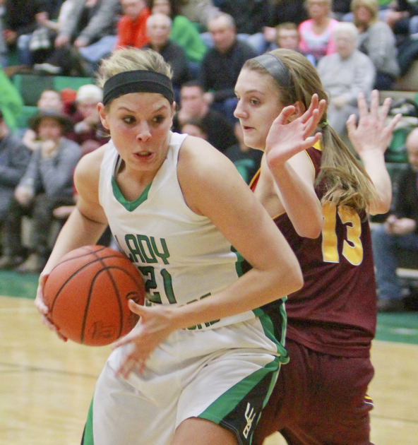 William D Lewis the Vindicator West Branch's Pavin Heath(21) drives around  Madison Durkin of South Range.