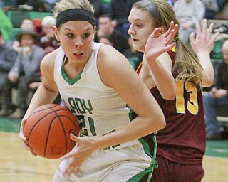 William D Lewis the Vindicator West Branch's Pavin Heath(21) drives around  Madison Durkin of South Range.