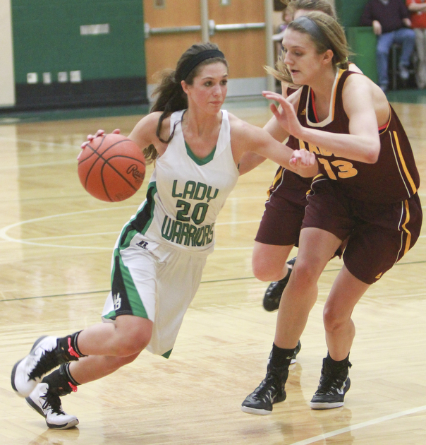 William d Lewis the Vindicator Kaylee Manning (20) of WR drives around Madison durkin(13)  of SR during Monday action at West Branch.