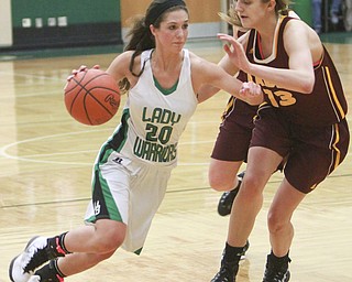 William d Lewis the Vindicator Kaylee Manning (20) of WR drives around Madison durkin(13)  of SR during Monday action at West Branch.
