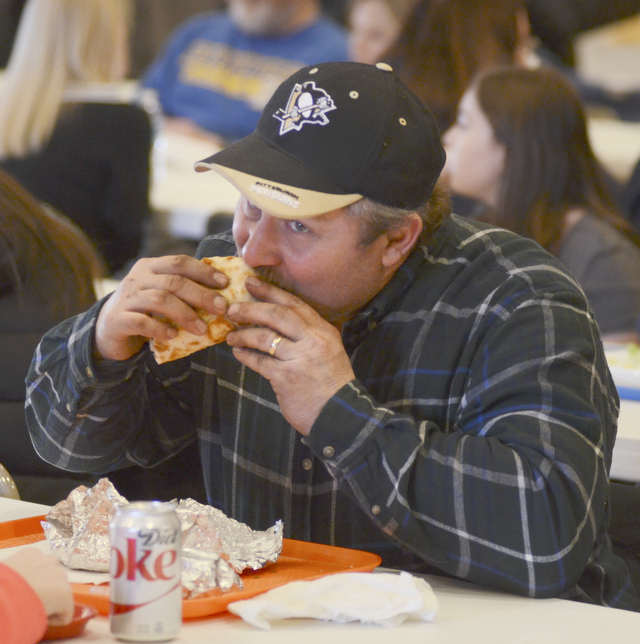 Katie Rickman | The Vindicator.Mike Lacusky of Austintown eats a traditional Greek Gyro during the first night of the Greek Festival at Archangel Michael Greek Orthodox Church in Campbell on Friday, Feb. 13, 2015.