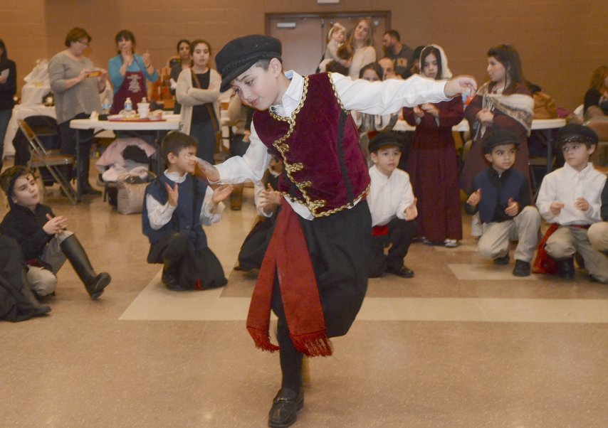 Katie Rickman | The Vindicator. John Frangos 8 of Hubbard dances a traditional Greek dance along with other children during the first night of the Greek Festival at Archangel Michael Greek Orthodox Church in Campbell on Friday, Feb. 13, 2015.