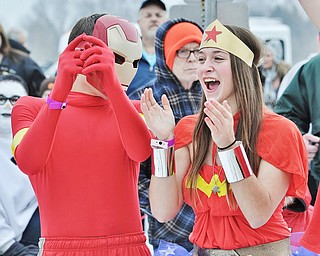 Jeff Lange | The Vindicator  Alexis Petrich (right) of Niles celebrates with Tim Dibacco of Hubbard after winning the group costume contest prior to the start of the Polar Plunge, Saturday afternoon at Mosquito Lake.