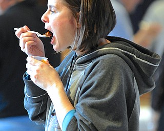 Jeff Lange | The Vindicator  Shawna Mukavetz of State College, PA tastes a chili brought in by one of the cookers during Sunday's 5th annual Sue Hernan Memorial Chili Cook-Off held at Boardman United Methodist Church.