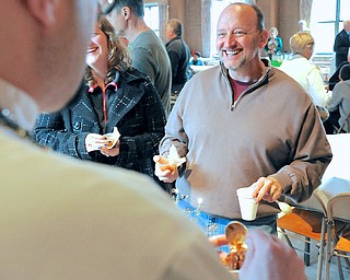 Jeff Lange | The Vindicator  Ed Christian of Salem laughs as Shane Russo pours some of his "Young People's Chili" four him, Sunday afternoon during the 5th annual Sue Hernan Memorial Chili Cook-Off held at Boardman United Methodist Church.