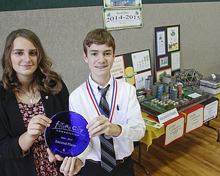        ROBERT K. YOSAY  | THE VINDICATOR..paige brockway and Matthew Rossi hold the second place trophy of 2172 of Youngstown..This version of the cityÕs future, as envisioned by a group of about 25 sixth-, seventh-, and eighth-grade Holy Family School students, won top honors at the state Future City Competition earlier this month.