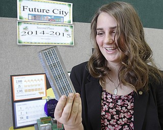        ROBERT K. YOSAY  | THE VINDICATOR...checking out one of the high rises is 8th grader paige brockway -- of  2172 of Youngstown..This version of the cityÕs future, as envisioned by a group of about 25 sixth-, seventh-, and eighth-grade Holy Family School students, won top honors at the state Future City Competition earlier this month.