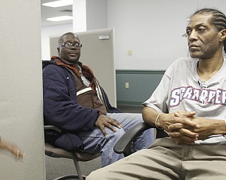        ROBERT K. YOSAY  | THE VINDICATOR..Charles Brown and Keith Lomax ..at the Methodist Community Center in downtown YTown.. Continuum of CareÕs annual  homeless count. a vet reads the form for counting the homeless