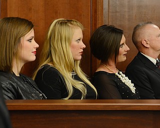 Katie Rickman | The Vindicator.The children and husband of Judge Carol Ann Robb listen during the swear-in ceremony  at the Seventh District of Appeals in Youngstown Wednesday, Jan. 28, 2015. From L-R Amanda Robb, Sarah Myers, Monica Robb and Kenneth Robb.