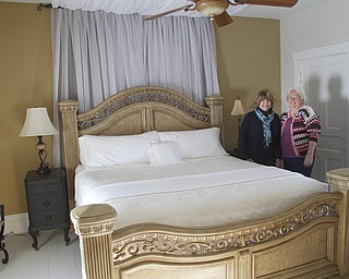        ROBERT K. YOSAY  | THE VINDICATOR.. The Main bedroom with fireplace -w Jan Pumphrey - Brenda Hernan, owners // and Bella Fattoria Bed and Breakfast - on Ellsworth Road open house Feb 8th.  A 100 year old home that was recently purchased and renovated to become a B&B - Right next door is Mastropietro Winery