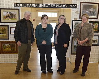 Katie Rickman | The Vindicator.Tom Kuster, Julie Norris, Mary Lynn Reid, Mitzi Kuster stand near a display of artifacts at Buhl Farm Park Casino on Friday, Jan. 30, 2015. The park is celebrating 100 years.