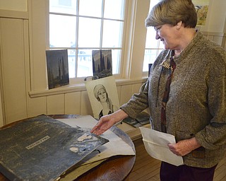 Katie Rickman | The Vindicator.Mitzi Kuster talks about the portfolio found at Buhl Farm Park dating back to the mid 1900's on Friday, Jan. 30, 2015.  Some of the artwork found shows various scenes from around the park.