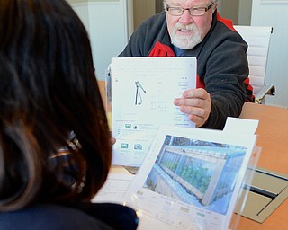 Jeff Lange | The Vindicator  Martin Reschner of Martin Luther Luthern Church shows an interviewer plans for their garden during his interview for a grant, Saturday morning at the Raymond John Wean Foundation building in Warren.