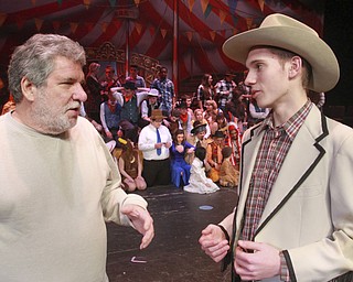 William D Lewis The Vindicator Dale Kushma, left, who played the role of Frank Butler in a  production of Annie Get Your Gun at Boardman HS 50 years ago talks with Nathaniel Ams, a Boardman HS 10th grader who is playing the same role in a current production. Pix taken during 2-3-15 rehersal.