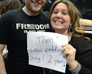 Katie Rickman | The Vindicator.Two fans hold a sign they made for the Brad Paisley concert saying that one of his famous songs was their wedding song on May 18, 2013.  Lauren and her husband Jake Kothe of Slippery Rock, PA smile before the show Friday, Feb. 6, 2015.