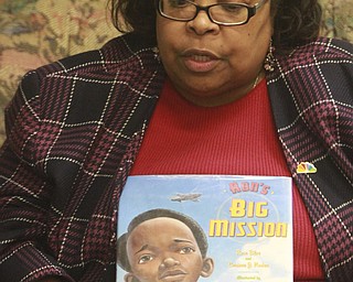 William D Lewis The Vindicator Madonna Chism Pinkard, director of community relations for WFMJ/WBCB Television and adjunct instructor at YSU reads a book  during a black History reading and story program  2-5-15 at the Warren Library.