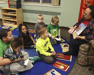 William D Lewis The Vindicator Madonna Chism Pinkard, director of community relations for WFMJ/WBCB Television and adjunct instructor at YSU reads a book to children during a black History reading and story program  2-5-15 at the Warren Library.