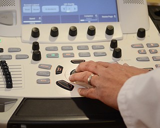 Katie Rickman | The Vindicator. Dr. Rekhi Varghese explains how  a GE Vivid 9 Cardio Vascular machine works at the Valve Clinic Cardiovascular Recover center at St. ElizabethÕs in Youngstown on Friday, Feb. 6, 2015.