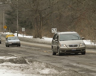        ROBERT K. YOSAY  | THE VINDICATOR..Pot Hole Season came early as hard freezes combined with thaws have got area roads.. full of the driving hazards ..On Glenwood Ave near Overhill has drivers driving in the center turn lane as they try to miss the potholes in the Northbound lanes. .-30-