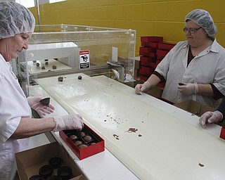        ROBERT K. YOSAY  | THE VINDICATOR..Gorant Choclatier   Packageing the  strawberries in boxes of 8 - is Joyce Stanley and Vicki Kuhlman .. . .-30-