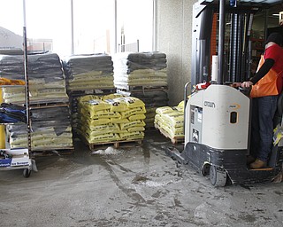        ROBERT K. YOSAY  | THE VINDICATOR..The yellow bags of rock salt steadily started to diminish from their palettes at the Home Depot in Austintown in the early afternoon on Tuesday.. A salt shortage had customers taking bag after bag of the ice melting salt... .-30-