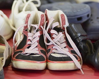 Katie Rickman | The Vindicator.A pair of donated shoes on a table at the Salvation Army in Youngstown on Wednesday, Feb. 11, 2015. Ankle and Foot Center donated over 500 pairs of shoes to the Salvation Army.