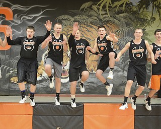 Katie Rickman | The Vindicator.Springfield seniors L-R Jordon Peterson, Tyler McLaughlin, Brandon Chamberlain, Mark Schuller, Hunter Snyder, Nate Simboli, and Neil Sofranec jump from a stage while joking round prior to practice at Springfield High School on Wednesday, Feb. 11, 2015.
