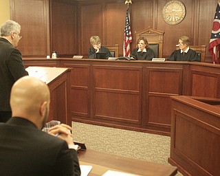        ROBERT K. YOSAY  | THE VINDICATOR..Judge Carol Ann Robb, (far right) whose six year term on the appeals court began Monday, and Judges Mary DeGenaro ( far left) and Cheryl L. Waite heard the case of a man appealing his conviction for threatening domestic violence.  Atty Mark Carfolo and Atty Ralph Rivera ( foreground)  plead their case