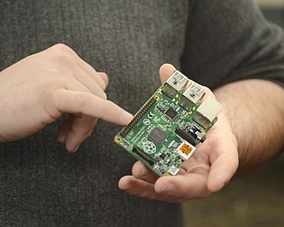 Katie Rickman | The Vindicator.Benjamin Dooley, the Information Technology teacher at Chaney High School points to the Rasberry Pi that students are using to build small technology pieces on Feb. 12, 2015.