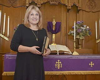 Katie Rickman | The Vindicator.Rev. Pamela Buzalka poses for a photo in the original sanctuary of Boardman United Methodist Church on Thursday, February 12, 2015. Rev. Buzalka will be teaching a series of sermons discussing the various aspects of Jesus for the Lenten season.