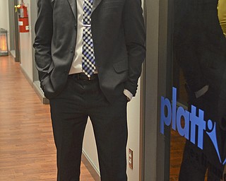 Katie Rickman | The Vindicator.Louis Lee an Associate Agent with Platt Insurance and Financial poses for a photo near his office that they rent from NYO Property Group in Youngstown. The NYO Property Group tenants hosted an open house.