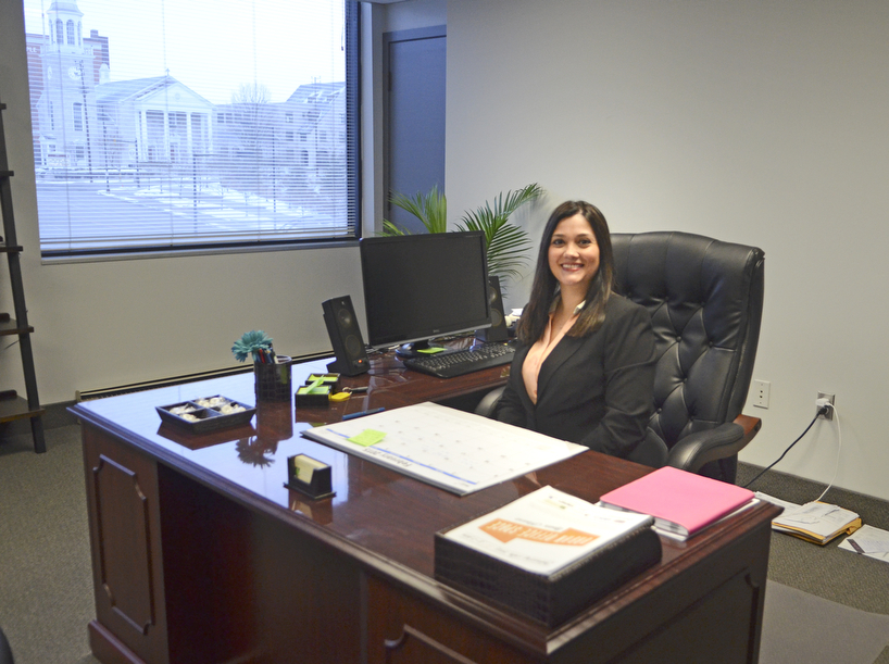 Katie Rickman | The Vindicator.CJ Green of Green Tax Service poses for a photo in her office that she rents from NYO Property Group in Youngstown. The NYO Property Group tenants hosted an open house.