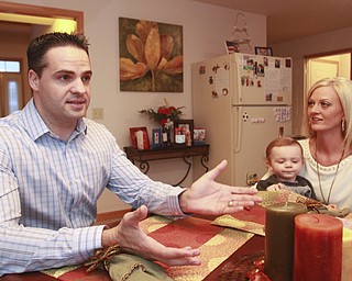 William D. Lewis the Vindicator Chip gilea, his wifeBrandy Gilea and son Luca, 16 months in their Canfield home. Chip recently became a US citizen.