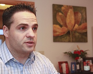 William D. Lewis the Vindicator Chip gilea,  in his Canfield home. Chip recently became a US citizen.