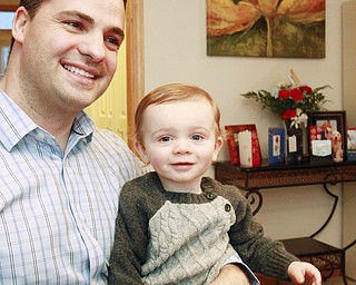 William D. Lewis the Vindicator Chip gilea and son Luca, 16 months in their Canfield home. Chip recently became a US citizen.