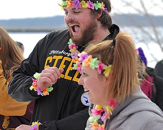 Jeff Lange | The Vindicator  Christian Syrianoudis of Canfield (back) dances "The Wobble" prior to hopping into the freezing waters of Lake Milton, Saturday afternoon during the Polar Bear Plunge in Lake Milton.