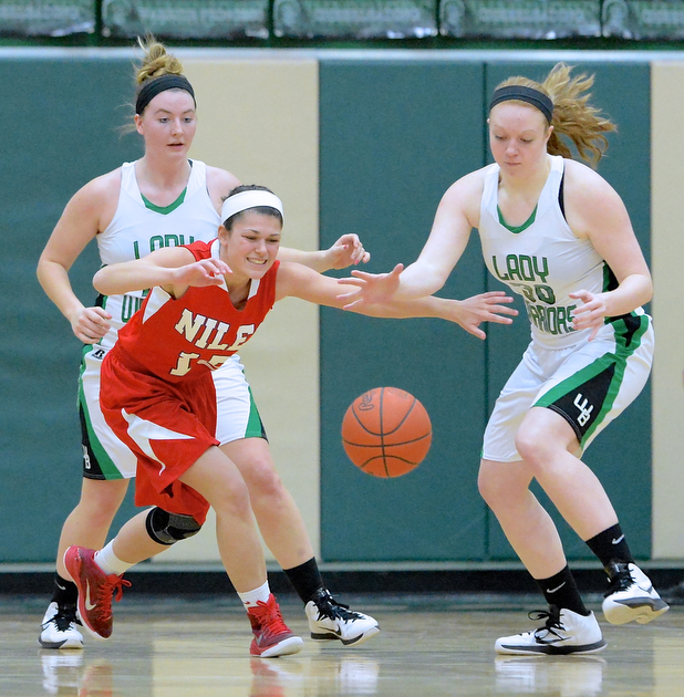 Jeff Lange | The Vindicator  Niles' Madison Huber races to the ball with Lady Warriors' Catie Hahn (right) as West Branch teammate Erica Johnson looks on from behind during first half action at West Branch High School. The Lady Warriors pounded Niles with a final score of 76 to 26.