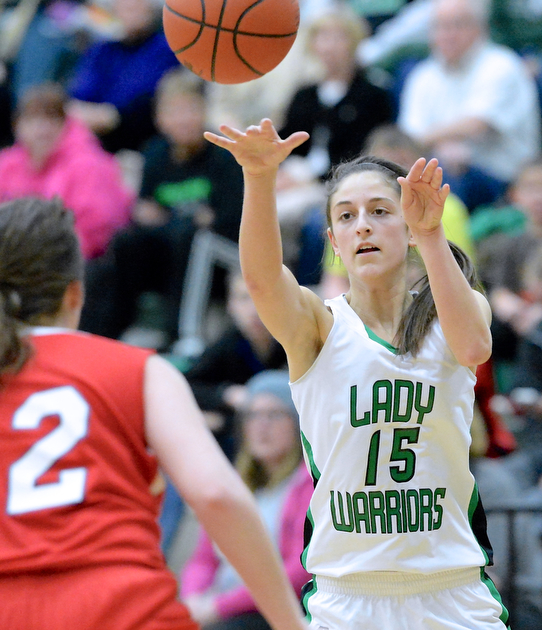 Jeff Lange | The Vindicator  West Branch's Emily Menegay (15) fires a pass over Niles' Ashley Cline in the second quarter of the Lady Warriors' game, Monday night.