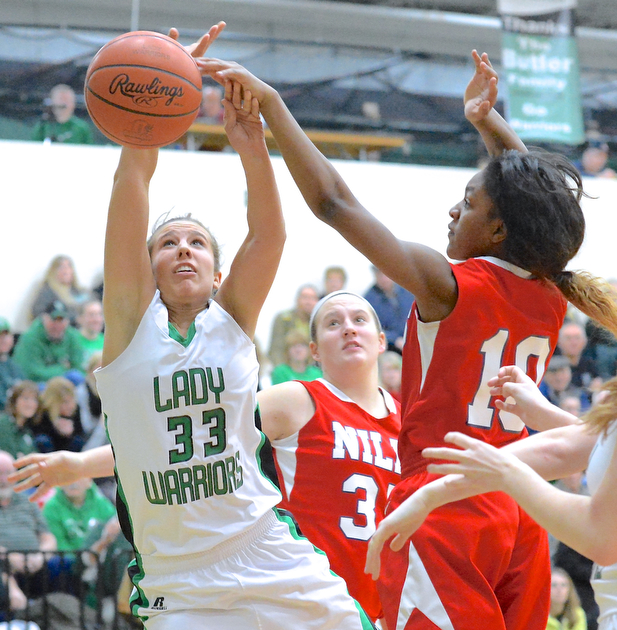 Jeff Lange | The Vindicator  West Branch's Claire Smith (33) has the ball knocked away as she attempts a layup by Niles' Kia Allen (10) in the second half of their matchup, Monday night at West Branch High School.