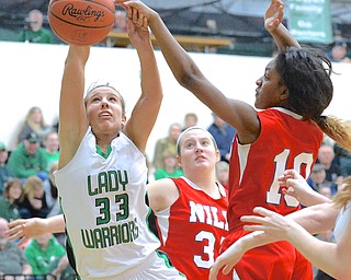 Jeff Lange | The Vindicator  West Branch's Claire Smith (33) has the ball knocked away as she attempts a layup by Niles' Kia Allen (10) in the second half of their matchup, Monday night at West Branch High School.