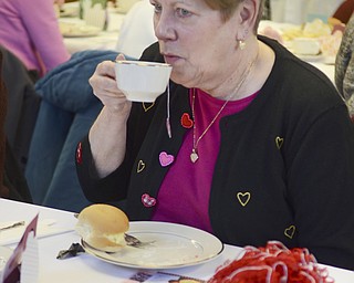 Katie Rickman | The Vindicator.Dorothy Andrews of Vienna enjoys a cup of tea during an afternoon tea at Salem public library as Kim Kenney from the McKinley Presidential Library and Museum in Canton speaks to a group of women about chocolate  on Feb. 13, 2015.