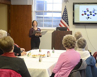Katie Rickman | The Vindicator.Kim Kenney a curator from the McKinley Presidential Library and Museum in Canton speaks to a group of women about chocolate during an afternoon tea at Salem Public Library on Feb. 13, 2015.