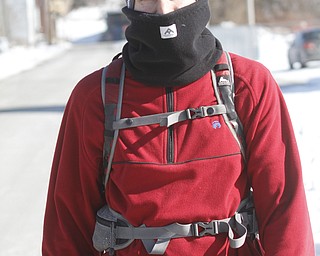        ROBERT K. YOSAY  | THE VINDICATOR..Dan Kuzma.. who not only walks to work over 2 miles.. but also walks as much as he can at lunch .. strolls down Tod Ave. despite single digit temperatures f. dan is from Youngstown