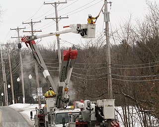        ROBERT K. YOSAY  | THE VINDICATOR..Snow and Cold and wind had a breaker on a transfomer on 46 in Canfield trip.  Ohio Edison reset the transformer and electric power was resumed.