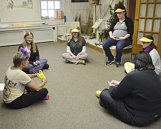 Katie Rickman | The Vindicator.A group of women sit in a circle as they finish the first Laughter Yoga class at Ford Nature Center in Mill Creek Park on Wed. Feb. 18, 2015. L-R.Teresa Lisum of Newton Falls (instructor) Julie Bartolone, Marily Williams, Cara Hahn, Hillary Lenton, and Carol Vigorito.