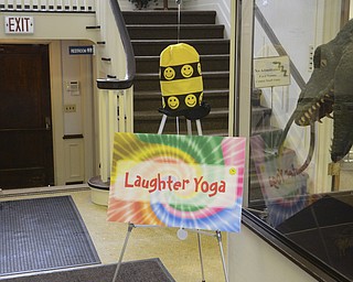 Katie Rickman | The Vindicator.The bright sign and smiley face decor directs the way to the the Laughter Yoga at Ford Nature Center in Mill Creek Park on Feb. 18, 2015.