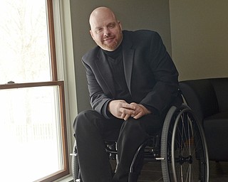 Katie Rickman | The Vindicator.Jeff Sanders, Executive Director of First Step Recovery of Warren poses for a photo next to a window in the office of the building that is under construction on Feb. 19, 2015. Sanders is a recovered addict, he was paralyzed when he jumped out of a window during recovery years ago.