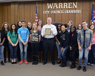 Katie Rickman | The Vindicator.Chief of Police Eric Merkel (center) stands with Warren G. Harding students who are in Key Club and also students involved with Student Council. The Students presented the WPD with a plaque on Thursday, Feb. 19, 2015.