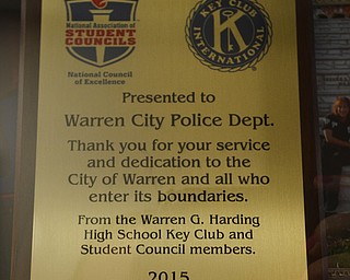 Katie Rickman | The Vindicator  .A plaque given to the Warren Police Department from Key Club and Student Council members from Warren G. Harding is on display at the Warren City Council Chambers building.